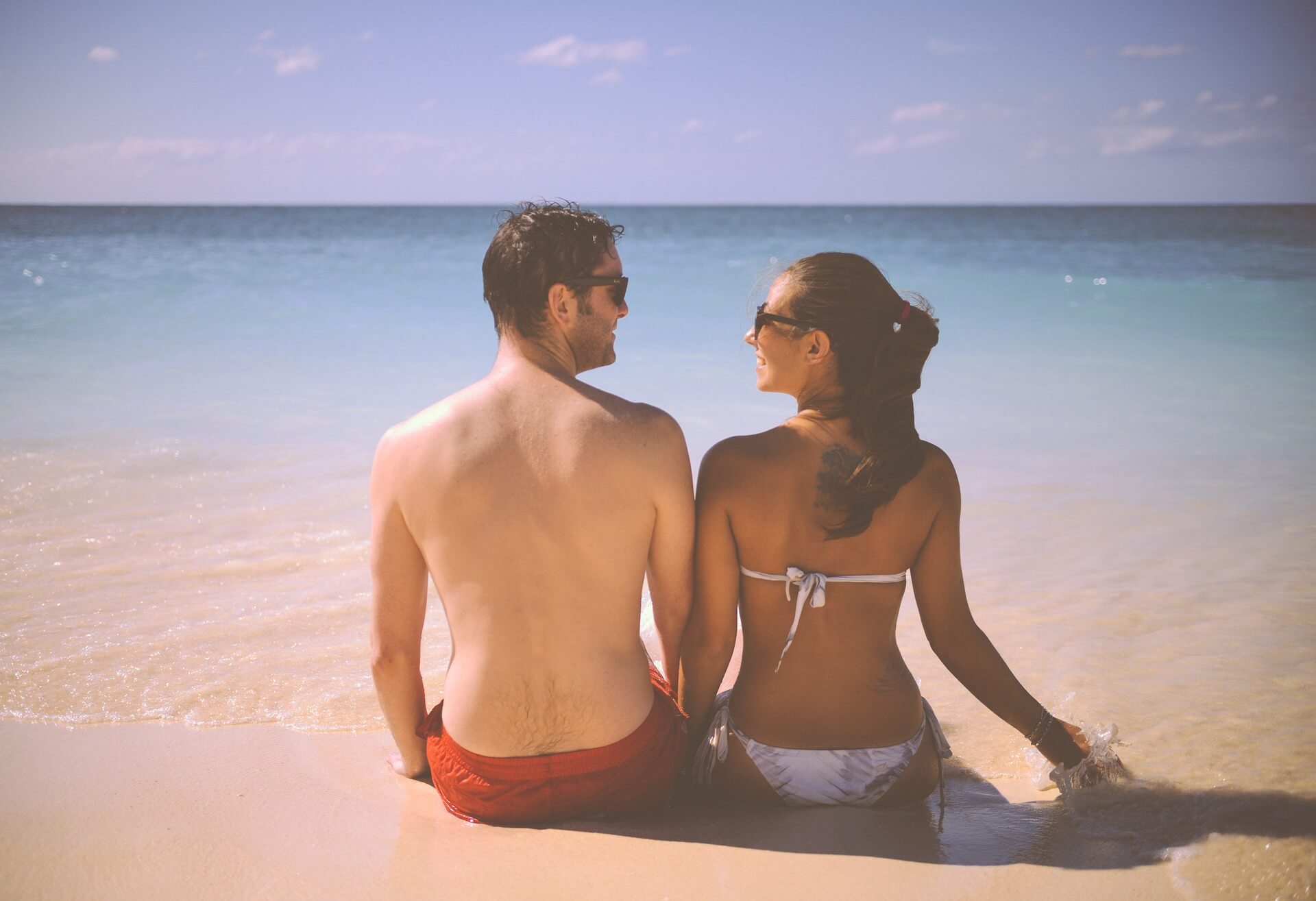 Couple Sat on Beach